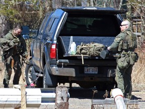 RCMP officers pack up after the search for Gabriel Wortman in Great Village, Nova Scotia, Canada April 19, 2020.