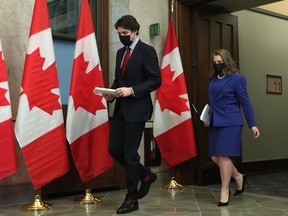 Justin Trudeau, Canada's prime minister, left, and Chrystia Freeland, Canada's deputy prime minister and finance minister, hold copies of the federal budget in Ottawa, Ontario, Canada, on Thursday, April 7, 2022.