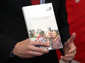 Justin Trudeau, Canada's prime minister, holds a copy of the federal budget in Ottawa, Ontario, Canada, on Thursday, April 7, 2022.