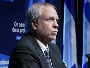 Interim Quebec director of Public Health Dr. Luc Boileau and Quebec Premier François Legault.