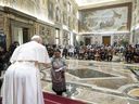 The final audience stands with Pope Francis and members of the Indigenous delegation where the pontiff delivered an apology for the Catholic Church's role in Canada's residential school system, at the Vatican, on April 1.