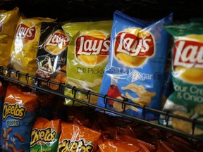 Frito-Lay snacks are displayed for sale inside a Royal Dutch Shell Plc gas station in Louisville, Kentucky, U.S., on Monday, April 13, 2015.