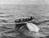 Collapsible B, the overturned lifeboat on which Joughin would eventually find safety after nearly two hours in the water. Shown here being recovered by crew members of the Canadian vessel Mackay-Bennett.