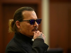 Actor Johnny Depp looks on at the Fairfax County Circuit Courthouse as his defamation case against ex-wife Amber Heard continues, in Fairfax, Virginia, U.S., April 19, 2022.