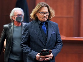 Actor Johnny Depp attends his defamation trial against his ex-wife Amber Heard at the Fairfax County Circuit Courthouse in Fairfax, Virginia, U.S., April 13, 2022.