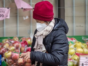 A woman shops for groceries at Toronto's Yao Hua Supermarket on Gerrard Street East in a file photo from Jan. 19, 2022.