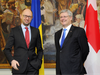 The Ukraine prime minister at the time, Arseniy Yatsenyuk, left, poses with his Canadian counterpart Stephen Harper before talks in Kiev on March 22, 2014.