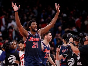 Joel Embiid of the Philadelphia 76ers waves after defeating the Toronto Raptors in Game Three of the Eastern Conference First Round at Scotiabank Arena on April 20, 2022.