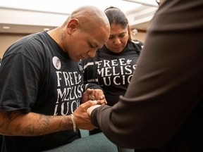 John Lucio and his wife Michelle Lucio pray before a hearing by the Interim Study Committee on Criminal Justice Reform about his mother, death row inmate Melissa Lucio, in Austin, Texas, U.S. April 12, 2022.