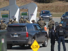 RCMP officers surrounded a gas station in Enfield, N.S. on Sunday April 19, 2020.