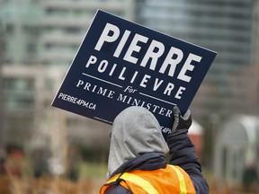 A supporter of Federal Conservative party leadership candidate Pierre Poilievre at The Roundhouse in Toronto, Tuesday April 19, 2022.
