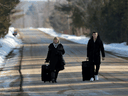 Asylum seekers walk on Roxham Road before crossing the border into Canada. With a shift from “how many people can we bring here?” to “how many people can we help make safer?” – global migration management could conceivably become a lot more coherent and humane.