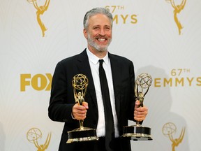 Jon Stewart holds his awards for Outstanding Writing For A Variety Series and Outstanding Variety Talk Series for Comedy Central's "The Daily Show With Jon Stewart" during the 67th Primetime Emmy Awards in Los Angeles, California September 20, 2015.