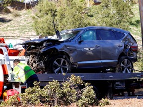 The damaged car of Tiger Woods is towed away after he was involved in a car crash, near Los Angeles, California, U.S., February 23, 2021.