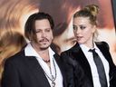 Actors Johnny Depp (L) and Amber Heard attend the Los Angeles Premiere of 