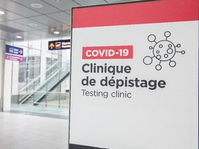 A sign for a COVID-19 testing clinic is seen at Montreal-Pierre Elliott Trudeau International Airport on April 1.