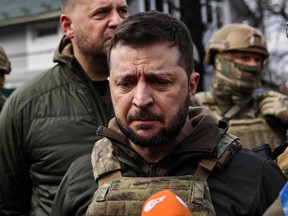 Ukraine's President Volodymyr Zelenskyy, visibly upset, speaks to the press in the devastated city of Bucha, northwest of kyiv, on April 4, 2022.