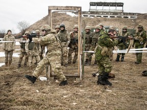 Canadian and American combat engineers demonstrate room clearing procedures to Ukrainian soldiers in Starychi, Ukraine, in 2017.