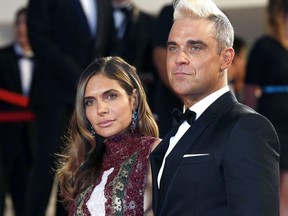 Robbie Williams and Ayda Field at a Cannes premiere.
