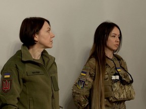 Hanna Maliar, Ukraine's deputy defense minister (left), listens as Sandra Andersen Eira talks about why she left her home in Norway to join Ukrainian forces fighting the Russian invasion.