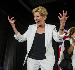 Kathleen Wynne dances on stage after announcing she is stepping down as leader of the Ontario Liberal Party following its historic 2018 loss.