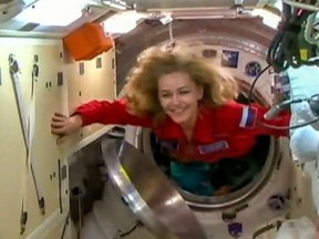 Actress Yulia Peresild enters the International Space station on October 5, 2021, after Russia launched an actress and a film director into space in a bid to beat the United States to the shooting of first movie in orbit.