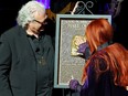Ricky Skaggs and Wynonna Judd accept induction on behalf of Naomi Judd to the Country Music Hall of Fame on May 1, 2022.