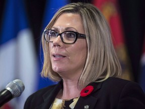 Manitoba Families Minister Rochelle Squires speaks at a news conference in Vancouver on Nov. 3, 2017. Squires has introduced a bill that would let people seek information about their partner's past if they believe there is a risk of violence to them or their children.