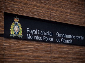 The RCMP logo is seen outside Royal Canadian Mounted Police "E" Division headquarters in Surrey, B.C., on April 13, 2018. An investigation into a deadly police shooting in Nunavut has concluded that no officer involved will face charges.