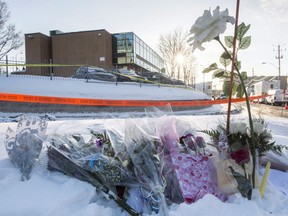 Flowers are seen near a mosque where a Sunday night shooting left six people dead and eight others injured in Quebec City, Monday, Jan. 30, 2017. The Supreme Court of Canada is slated to rule today on the sentencing of a man who went on a deadly shooting spree at a Quebec City mosque.