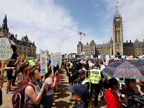 Abortion rights campaigners are separated from an anti-abortion rally by Parliamentary Protective Service members on Parliament Hill in Ottawa, Ontario, Canada May 12, 2022. REUTERS/Blair Gable