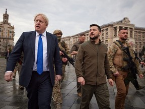 British Prime Minister Boris Johnson and Ukrainian President Volodymyr Zelensky walking in central Kyiv, on April 9, 2022.