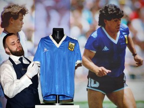 The jersey that Argentina football legend Diego Maradona wore when scoring twice against England in the 1986 World Cup, including the infamous "hand of God" goal, was auctioned for $9.3 million, a record for any item of sports memorabilia, Sotheby's said May 4, 2022.