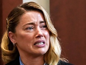 Amber Heard testifies at Fairfax County Circuit Court on May 4, 2022, about the first time she says her ex-husband, actor Johnny Depp hit her.
