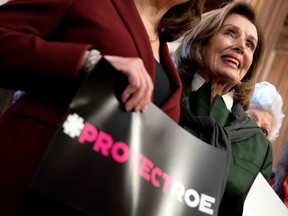 In this photo from May 13, 2022 U.S. Speaker of the House Nancy Pelosi joins House Democrats and pro-choice advocates for photos before a press conference about the leaked Supreme Court draft decision on Roe v. Wade, at the U.S. Capitol in Washington, D.C.