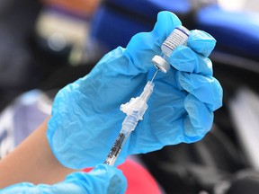 The risks of COVID-19 are subsiding, but risks from unhealthy lifestyles persist. (Photo by FREDERIC J. BROWN / AFP via Getty Images)