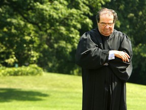Then U.S. supreme court justice Antonin Scalia, shown outside the White House in June 2006, famously warned his new clerks: “If I ever discover that you have betrayed the confidences of what goes on in these chambers, I will do everything in my power to ruin your career".