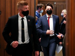 Prime Minister Justin Trudeau, shown leaving a caucus meeting on Wednesday, May 4, 2022, invoked one of his father's most memorable quips when asked whether he had uttered unparliamentary language.