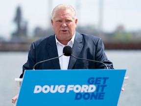 Ontario Progressive Conservative Leader Doug Ford makes an announcement with Stelco as a backdrop during an election campaign stop in Hamilton on May 18, 2022.
