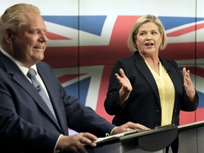 Ontario NDP Party Leader Andrea Horwath speaks beside Ontario PC Party Leader Doug Ford during the Ontario party leaders' debate, in Toronto, May 16, 2022.