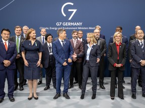 G7 officials and energy ministers, including Canadian Steven Guilbeault, center, pose during a summit in Berlin on May 26, 2022.