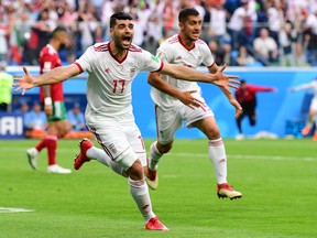 Iranian forward Mehdi Taremi reacts after Morocco scored on itself during the Russia 2018 World Cup Group B football match between Morocco and Iran in Saint Petersburg on June 15, 2018. Terry Glavin decries the fact that Soccer Canada is paying Iran's soccer federation $400,000 to play in Vancouver next month.