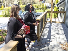 Kate Graham, Liberal candidate in London North Centre, campaigns with London West MP Arielle Kayabaga on Stoneybrook Crescent in London. (Mike Hensen/The London Free Press)