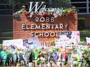 A memorial for the 19 children and two teachers killed in Tuesday's mass shooting at Robb Elementary School is seen on May 27, 2022 in Uvalde, Tex.