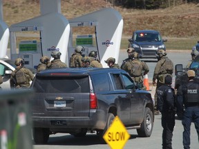 RCMP officers prepare to take mass shooter Gabriel Wortman into custody at a gas station in Enfield, N.S. on Sunday April 19, 2020.