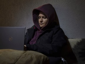 Anastasia Nikulina writing her war diary in the Banana Street bomb shelter during an air raid.