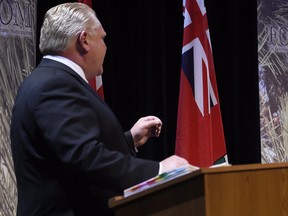 Ontario Progressive Conservative Leader Doug Ford is seen with a binder during a leaders' debate in 2018.