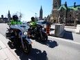 Police patrol Wellington Street in Ottawa prior to the arrival of the "Rolling Thunder" convoy protest on Friday, April 29, 2022. THE CANADIAN PRESS/Sean Kilpatrick