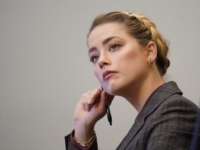 Amber Heard looks on during the defamation case against her by ex-husband Johnny Depp, in Fairfax, Va., May 2, 2022.