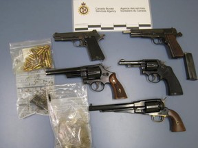 The vast majority of Canadian handgun crimes are committed with firearms smuggled in from the U.S., such as these pistols seized at a Manitoba border crossing in 2011.